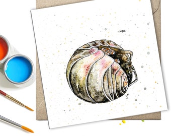 May include: A watercolor illustration of a pill bug curled up in a ball. The background is white with a light yellow splatter pattern. The text "nope." is written in black at the top of the card.