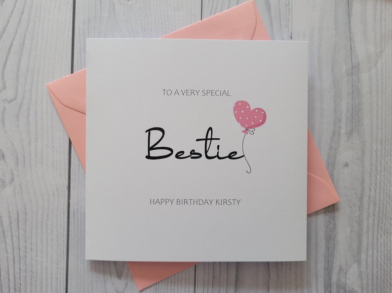 May include: A white card with a pink heart balloon and the text "To a very special Bestie Happy Birthday Kirsty".