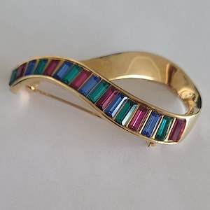 Retired Swarovski Brooch Colorful Baggetue Crystals  set in Goldtone Metal signed Swan