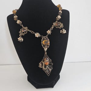 Antique Art Deco Czech Light Brown Glass Elaborate Filigree Brass Dragon and Enameled Flowers Long Necklace 1920s