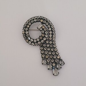 Vintage Brooch Clear Color Crystals Elegant Waterfall Design set in Black Metal