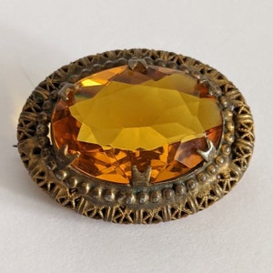 Vintage Honey Rhinestone Brooch: Ornate Goldtone Setting