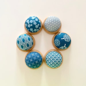 Handmade pin cushion, cotton fabric with blue and white pattern prints, wooden base, Japanese traditional patterns