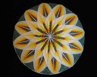 handmade temari ball with traditional Japanese kiku pattern, "chrysanthemum" flower