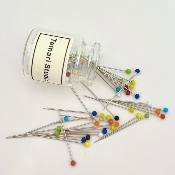 Glass head pins. Sewing/quilting pins. 50 pieces per bottle. Rainbow/transparent colours mixed. Extra thin and sharp, small head.