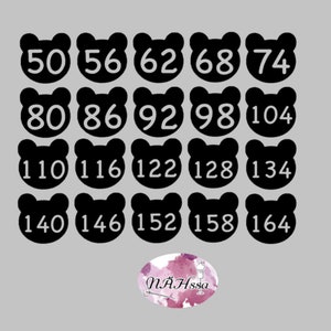 May include: Black and white bear-shaped stickers with numbers from 50 to 164 in increments of 6. The numbers are in white and the bears are black.