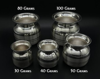 May include: Five silver metal pots of varying sizes, labelled with their weight in grams: 30 grams, 40 grams, 50 grams, 80 grams, and 100 grams.