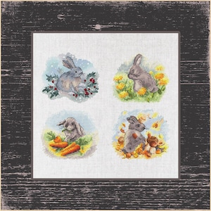 May include: Four cross-stitch patterns featuring a gray rabbit in different seasons. The top left pattern shows a rabbit in a snowy winter scene, the top right shows a rabbit in a spring meadow, the bottom left shows a rabbit in a summer garden, and the bottom right shows a rabbit in an autumn forest.