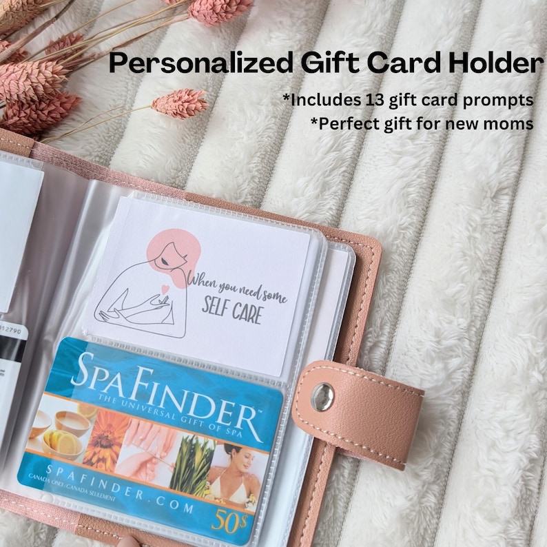 May include: A pink leather gift card holder with a clear plastic insert for holding gift cards. The holder has a small metal button closure and the text "When you need some SELF CARE" is visible in the insert.