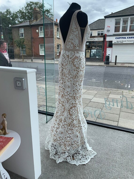 lace wedding dress with tan underlay
