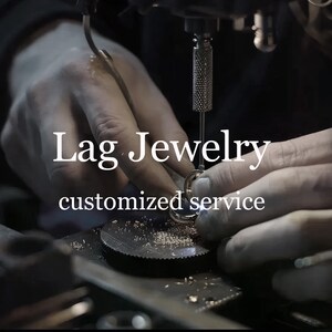 May include: Close-up of jewelry being crafted. The image shows a jeweler working on a piece of jewelry with tools. The text "Lag Jewelry" and "customized service" are displayed in white.