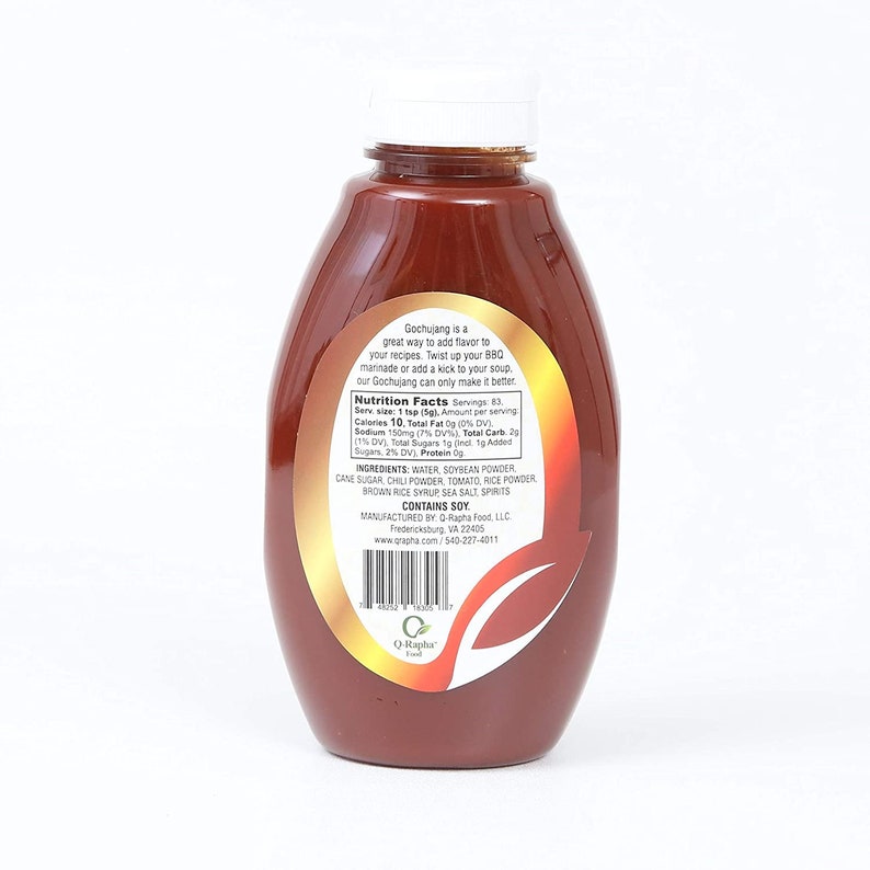 May include: A brown glass bottle of Gochujang Korean chili paste with a label that reads "Gochujang is a great way to add flavor to your recipes. Twist up your BBQ marinade or add a kick to your soup. Our Gochujang can only make it better." The label also includes nutrition facts and ingredients.