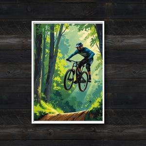 Puede incluir: Una impresi&oacute;n art&iacute;stica enmarcada que muestra a un ciclista de monta&ntilde;a en el aire en un sendero a trav&eacute;s de un bosque verde exuberante. El ciclista viste una camiseta azul de manga larga, pantalones oscuros y casco sobre una bicicleta negra.