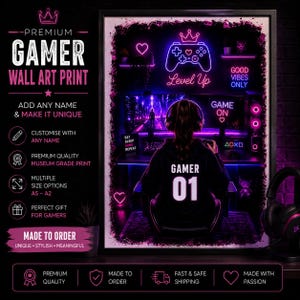May include: A framed wall art print with a black border. The print features a gamer in a hoodie with the number 01, playing a video game. Neon lights spell "Level Up" and "Good Vibes Only". The text "Gamer Wall Art Print" is at the top.
