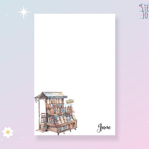 May include: A watercolour illustration of a wooden book stand filled with books. The stand has a sign that says "Books". The illustration is on a white background with the word "June" written below the stand.