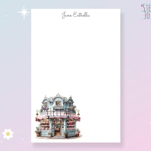 May include: A printable stationery template featuring a whimsical illustration of a pastel blue building with pink awnings and the word "Stellar" on the front. The text "June Estrella" is at the top of the page.
