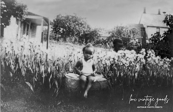 Photo postcard of young girl holding her baby sibling Canada c. 1920s Photo postcard of young girl holding her baby sibling Canada c. 1920s