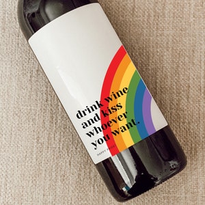 May include: A wine bottle label with a rainbow design and the text "drink wine and kiss whoever you want." The label is 4 inches by 5 inches.