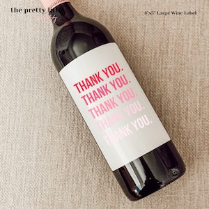 May include: A white wine bottle label with the text "THANK YOU." repeated five times in a gradient of pink and red.