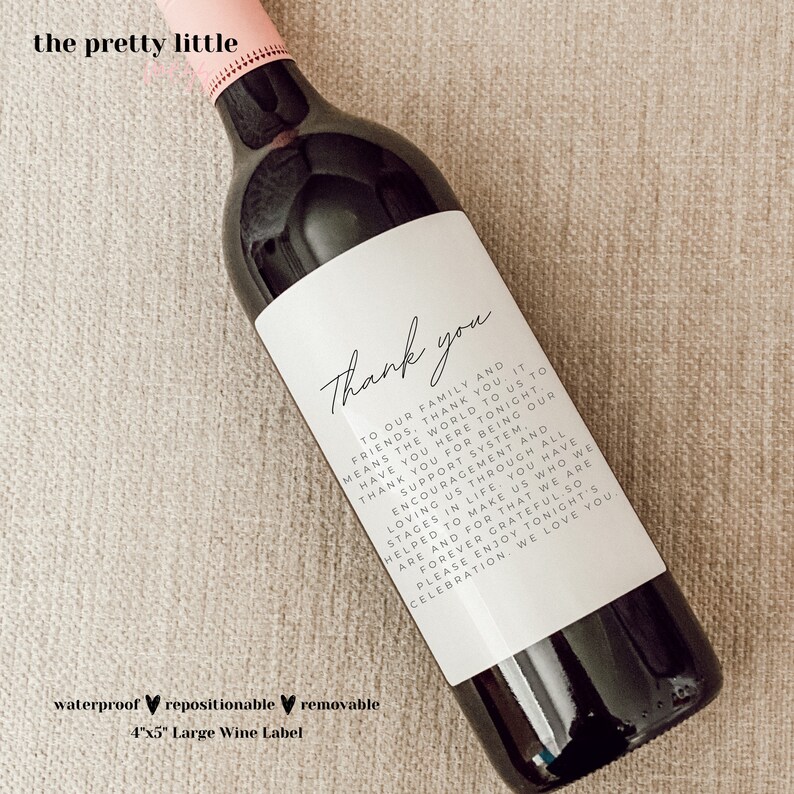 May include: A white wine bottle label with black text that reads "Thank you to our family and friends, thank you. It means the world to us to have you here tonight. Thank you for being our support system. Encouragement and loving us through all stages in life, you have helped to make us who we are and for that we are forever grateful. So please enjoy tonight's celebration. We love you."
