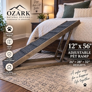 May include: An adjustable pet ramp by Ozark Natural Designs measuring 12 inches by 56 inches. The ramp features a sturdy wood frame with a dark gray textured surface for traction. It is designed to fold flat and adjusts to heights of 24, 28, and 32 inches.