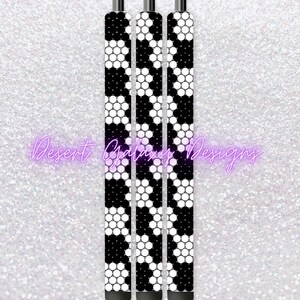 May include: Three black pens with a white and black honeycomb pattern. The pens are lined up side by side.