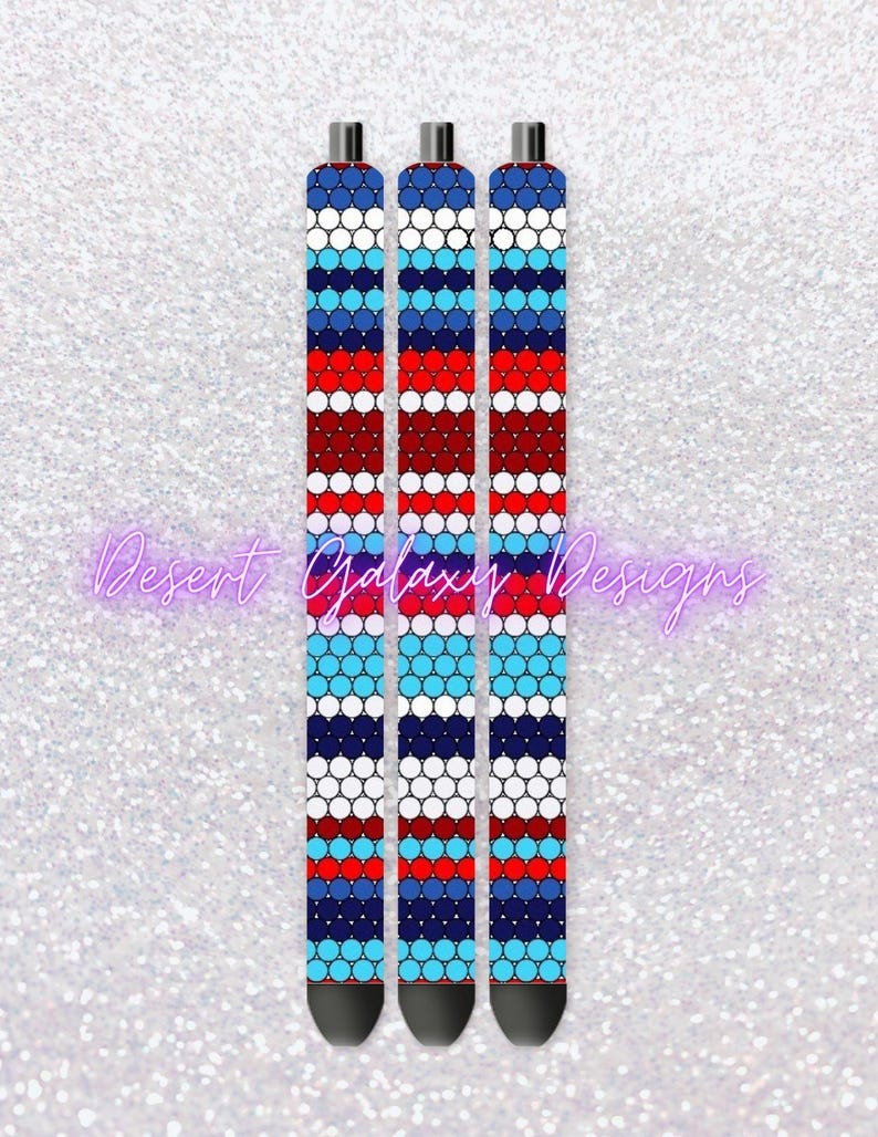May include: Three black pens with a red, white, and blue geometric pattern. The pattern is made up of circles and stripes.