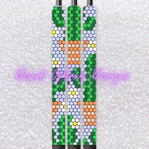 May include: Three pens with a green, white, and orange geometric pattern. The pattern features small circles and flowers.