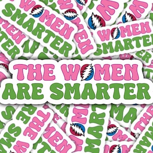 May include: A sticker sheet with multiple stickers featuring the text "The Women Are Smarter" in pink and green lettering with a graphic of a lightning bolt. The stickers are on a white background.