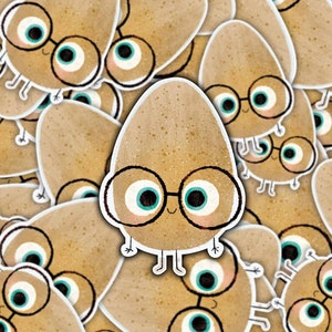 May include: A pattern of brown potato-shaped stickers with googly eyes and glasses. Each potato has a different expression.