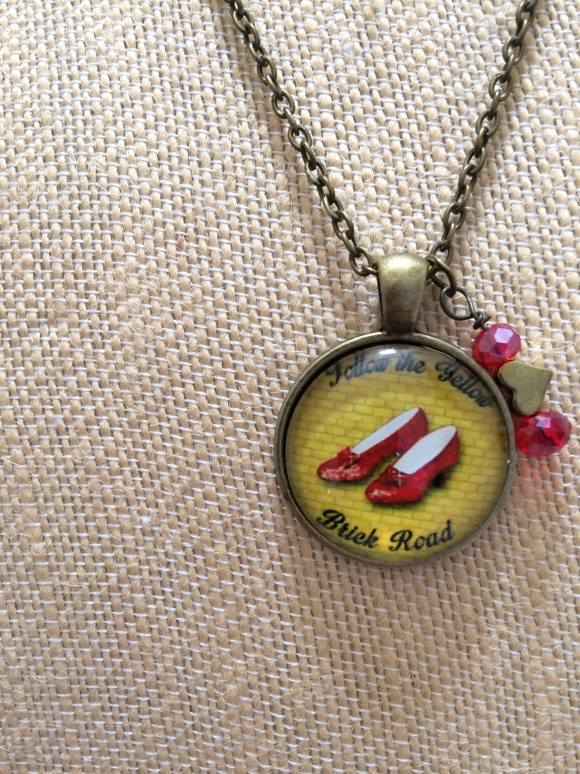 Wizard of Oz Ruby Slippers Necklace, Antique Gold Metal, follow the