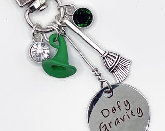 Wicked Movie, Book and Play Clip On DEFY GRAVITY Bag Charms Jewelry for your Purse, Backpack, Zipper, wherever you please!