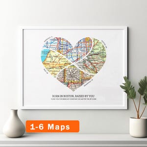 May include: A framed wall art print featuring a heart-shaped collage of colorful road maps. The text below the heart reads: BORN IN BOSTON, RAISED BY YOU. THANK YOU FOR BEING MY CONSTANT, NO MATTER THE ZIP CODE. The print is displayed in a white frame.
