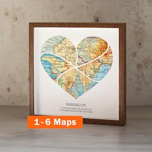May include: A framed heart-shaped map art piece. The map is divided into sections, with the word "HAITI" visible. The frame is brown, and the artwork includes the text "WANDERLUST" and "1-6 Maps".