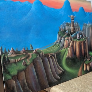 May include: An acrylic painting depicting a fantasy landscape with a fortress on a cliff, linked by bridges to a village. The sky fades from orange to blue, with mountains in the background. The artwork is on canvas.