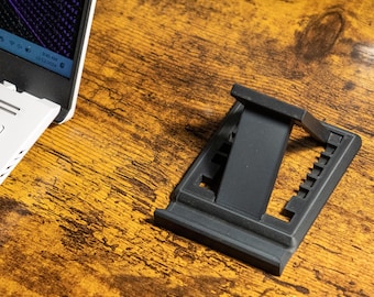 Support pour téléphone. Support compact pour téléphone et tablette. Support de téléphone pliable au format de poche. Imprimé en 3D.