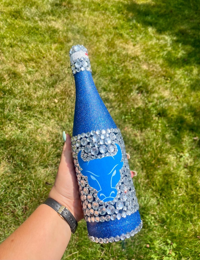 SUNY Buffalo bottle with blue glitter.