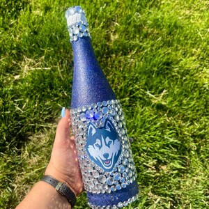 University of Connecticut bottle with navy blue glitter.