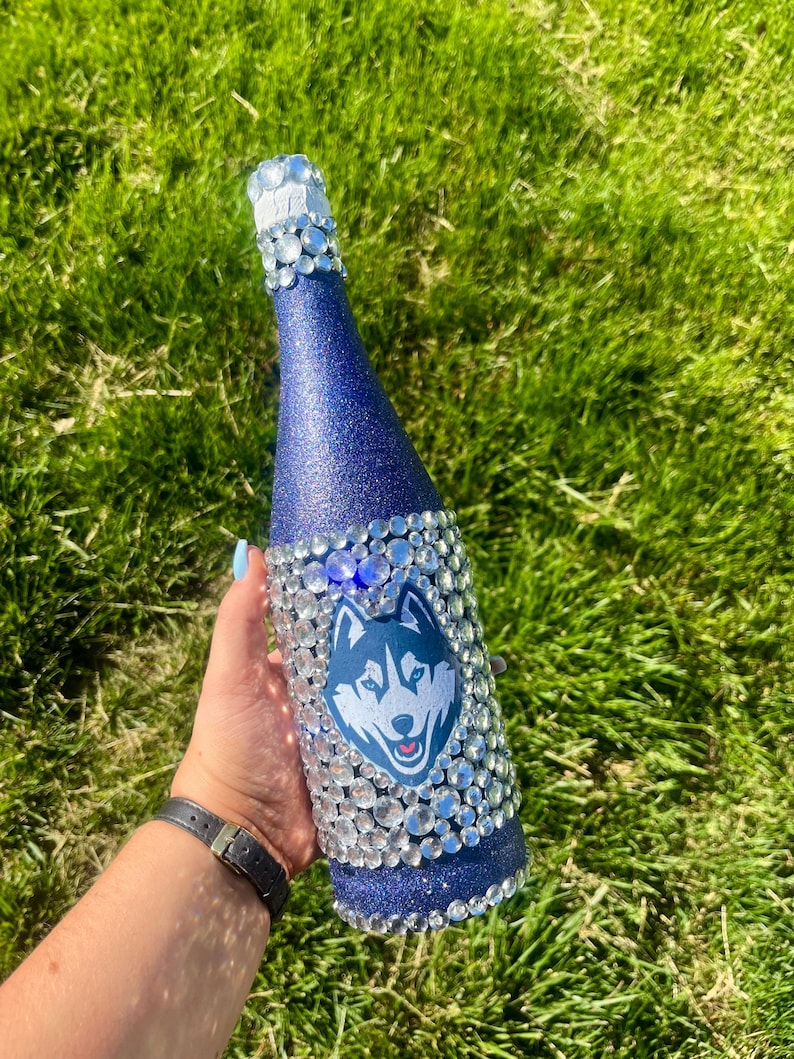 University of Connecticut bottle with navy blue glitter.