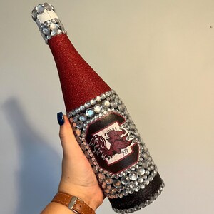University of South Carolina bottle with maroon and black glitter.