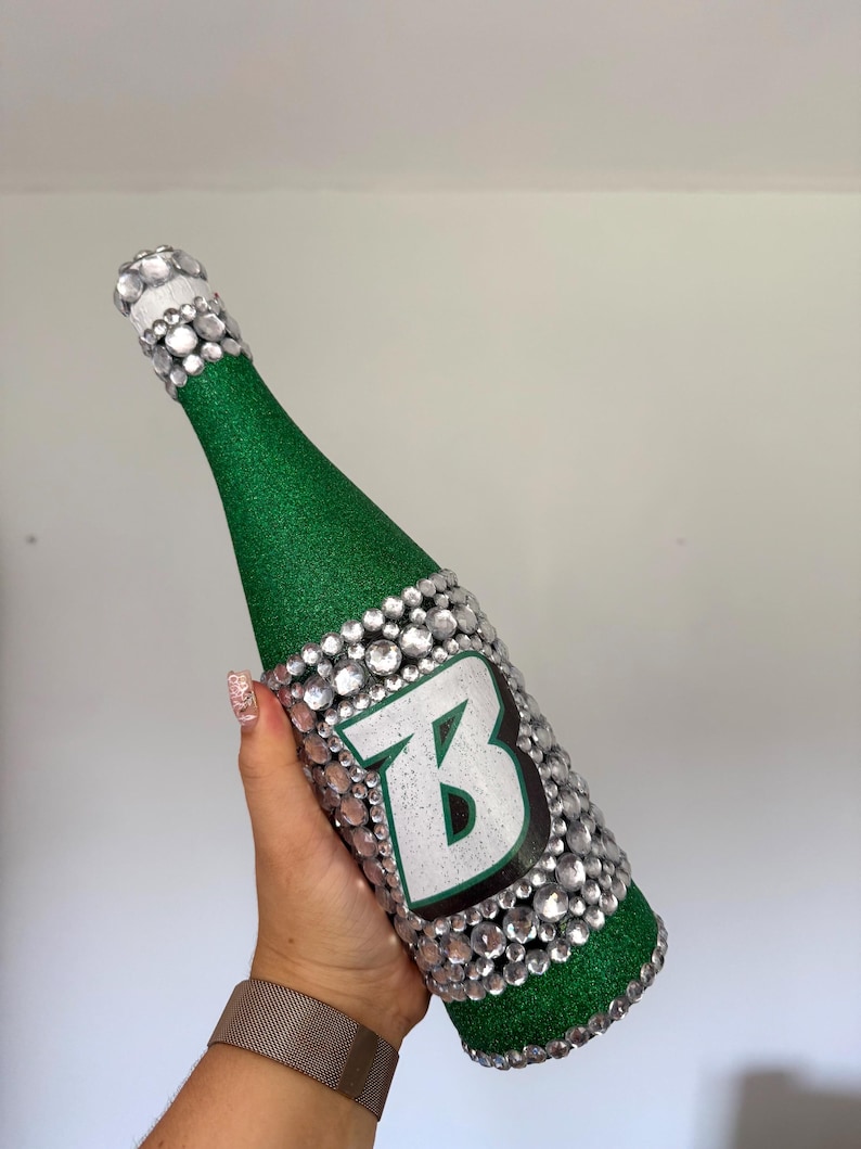 SUNY Binghamton bottle with green glitter.