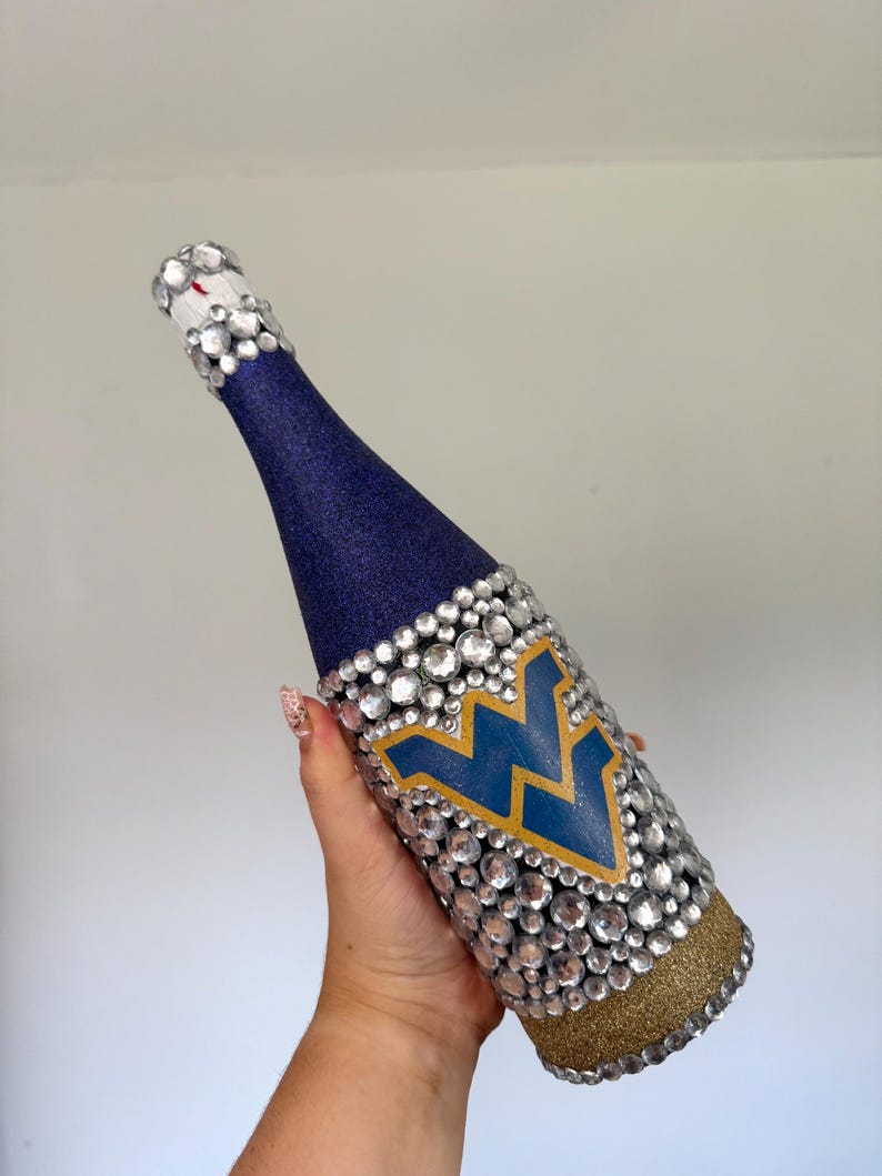 University of West Virginia bottle with navy and gold glitter.