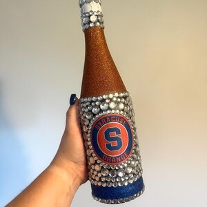 Syracuse University bottle with orange and blue glitter.