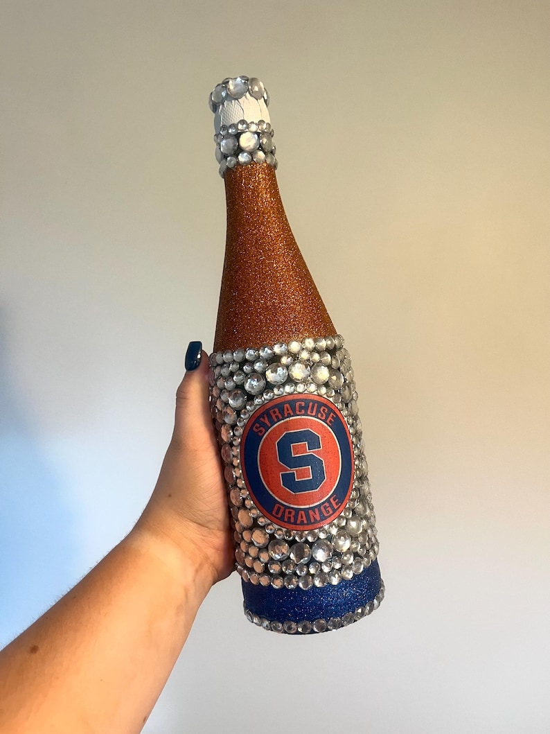 Syracuse University bottle with orange and blue glitter.