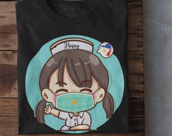 May include: Black t-shirt with a cartoon illustration of a nurse wearing a face mask with the Philippine flag. The text "Pinay" is written on the nurse's hat.