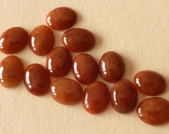 Natural Orange Jades Oval Cabs / 9x7 mm. Size Range / Hand Cut stones Vary Slightly in size / Flat Backs / Mixed Lots