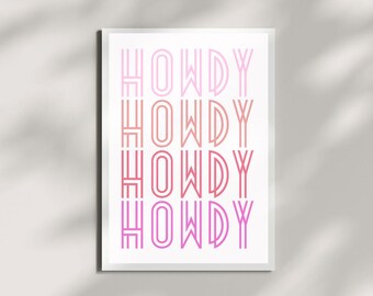 May include: A white poster with the word "Howdy" repeated four times in a gradient of pink and red. The word is in a bold, outlined font.