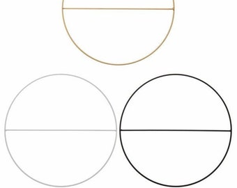 May include: Three circular metal hoops with a horizontal bar across the center. The hoops are gold, white, and black.