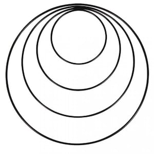 May include: Set of four black metal hoops, each with a different diameter, arranged in a concentric pattern.