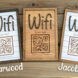 May include: Three wooden signs with the word "Wifi" and a QR code that says "Scan me!" The signs are in different wood stains: Charwood, Natural, and Jacobean.